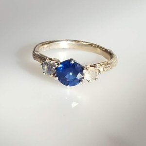 Blue and white stone ring with intricate band